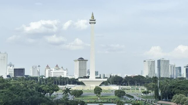 4K video footage view of the National Monument (Monas) with a clear, cloudy afternoon sky in Jakarta, Indonesia