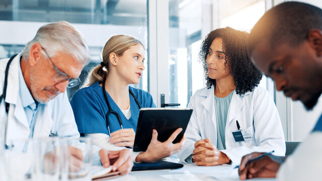 Woman, doctors and team with tablet at hospital, review and planning with report for virus. People, medical staff and meeting with feedback, application and talk for solution in boardroom at clinic