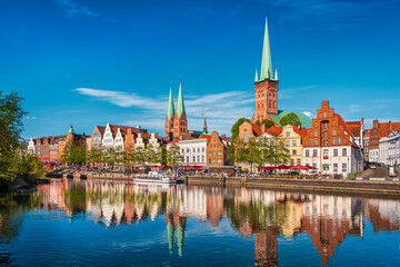 Historic skyline along the Trave river in the old town of Lubeck, Germany on a summer day