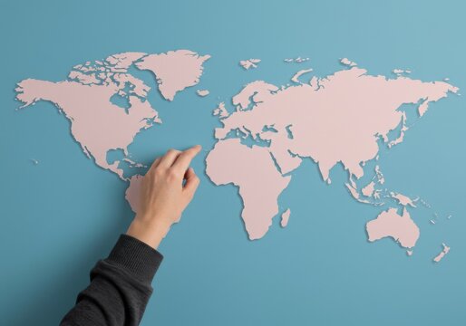 Hand pointing to Africa on a world map