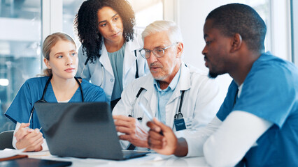 Laptop, meeting and team of doctors in hospital boardroom with medical report for treatment planning. Computer, research and group of healthcare workers with manager for surgery schedule in clinic.