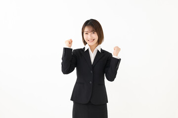 ガッツポーズをする女性