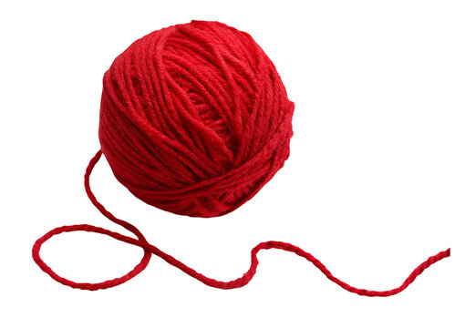 A vibrant red ball of yarn with a loose strand against a stark black background in a studio shot