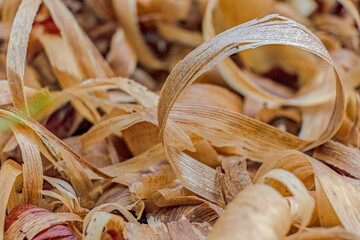 A heap of curly wood shavings; focus stacking macrophotography captured outside a carpenter's shop...
