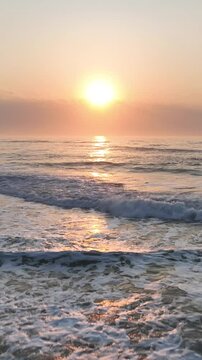 Florianopolis in Santa Catarina during a wonderful sunrise. Mo&ccedil;ambique Beach in aerial view, vertical video.