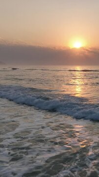 Florianopolis in Santa Catarina during a wonderful sunrise. Mo&ccedil;ambique Beach in aerial view, vertical video.