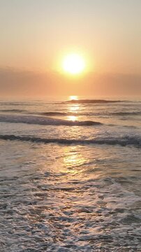 Florianopolis in Santa Catarina during a wonderful sunrise. Mo&ccedil;ambique Beach in aerial view, vertical video.