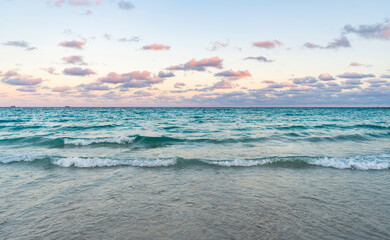 Skyscape with sea horizon. Calm horizon view at sea sunrise. Romantic summer vacation sunrise on seascape. Sea horizon view. Cloudy sky and seascape at summer vacation. Sea waves