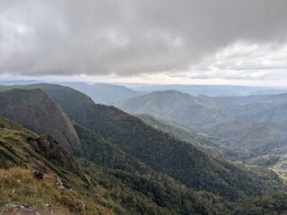 Naklejka premium Wide Horizon of Misty Forested Hills