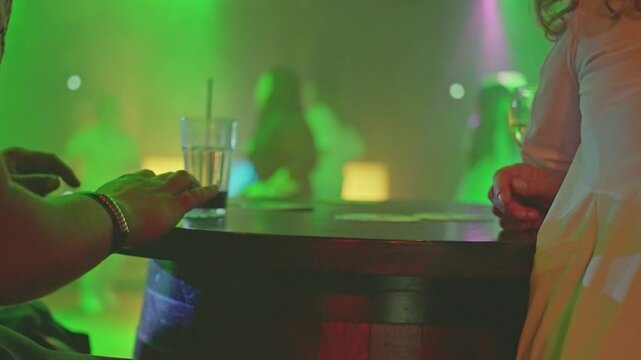 Enjoying a vibrant and unforgettable night out at a trendy bar with close friends and laughter