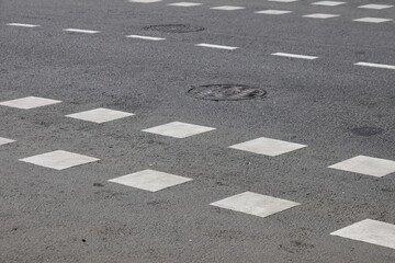 road markings on asphalt, manhole covers, traffic safety, 2