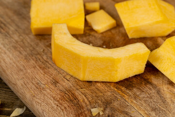 pumpkin cut into pieces , preparing the pumpkin for cooking by cutting into pieces, side view