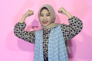 Indonesian Muslim woman with strong body movements who is a young businesswoman