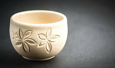 happy travel concept. Ceramic cup with floral design on a dark background.
