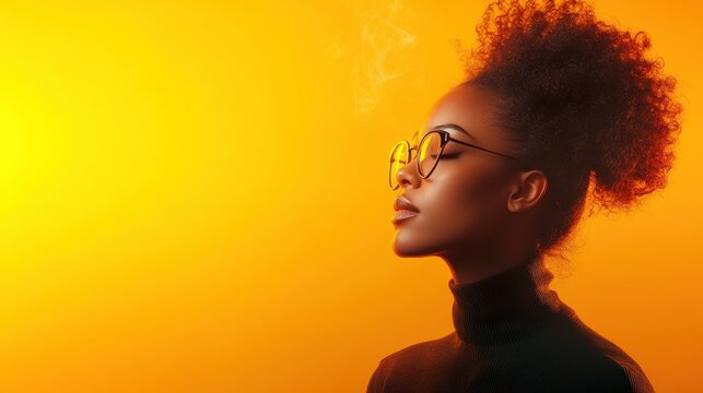 An elegant woman with curly hair and glasses profiles against a warm orange backdrop, capturing beauty, confidence, and sophistication in a minimalistic style.