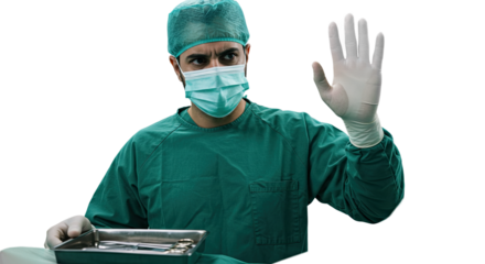 Surgeon in scrubs holding surgical instruments gesturing with hand in a medical environment