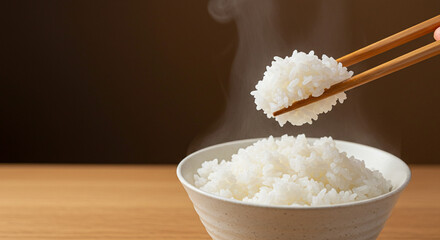 Steaming hot Japanese white rice in white bowl