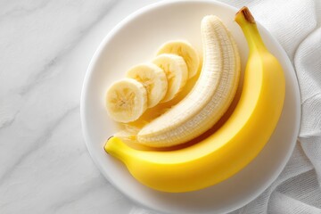 Freshly sliced banana on a white plate.