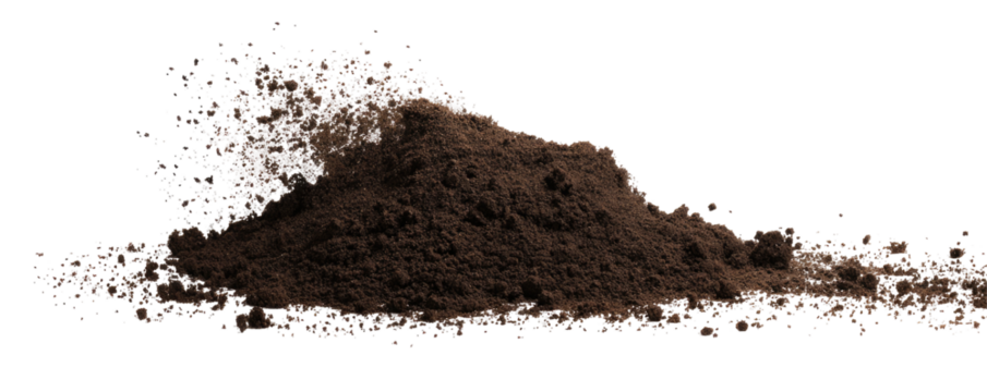 A mound of dark brown soil or dirt is seen against a black background in a studio like setting