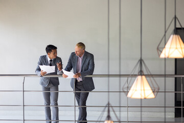 Business meeting : Business colleagues talking in the office. Group of business man talking in modern office building