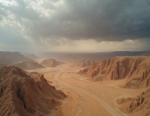 Fototapeta premium Aerial view of vast Judean Desert in Israel under cloudy sky. Arid landscape with mountains and horizon. Travel tour adventure. Remote terrain wilderness.
