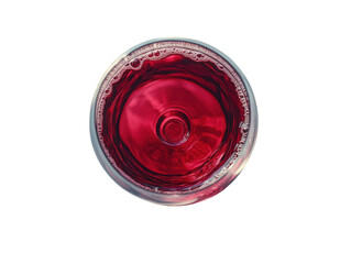 A glass of red wine is sitting on a white background