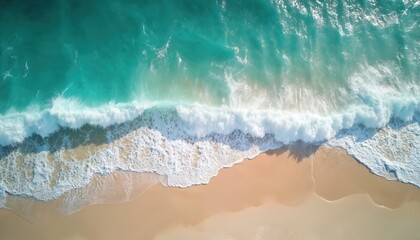 Aerial view of crashing waves on tropical beach shoreline. Turquoise water, white foam, golden sand create paradise landscape. Coastal scenery perfect for vacation, surfing, travel, holidays. Ocean