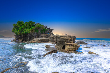 Tanah Lot Temple on the island of Bali known as the island of Gods. Sitting on top of rock island...