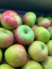 Fresh Green Red Apples on Grocery Shelf
