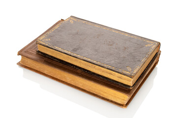 Two old rare books isolated on white background, close-up.
