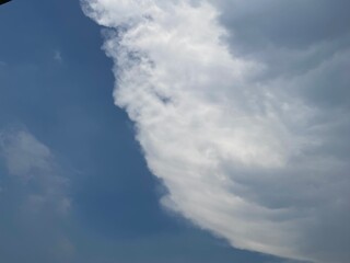 Beautiful round clouds after the rain, under a gloomy sky, big, Soft, round clouds floating in the moody sky 