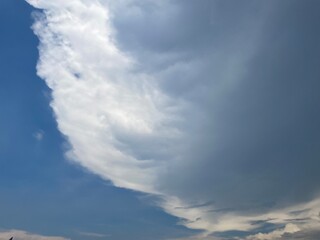 Beautiful round clouds after the rain, under a gloomy sky, big, Soft, round clouds floating in the moody sky 