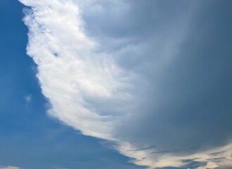Beautiful round clouds after the rain, under a gloomy sky, big, Soft, round clouds floating in the moody sky 