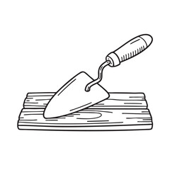 A wooden plank with a trowel on top