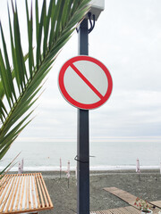 round white and red restriction sign on the beach, mockup