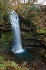 Fototapeta premium Immortalised by the poetry of W.B. Yeats, Glencar Waterfall, County Leitrim, Ireland. Scenic waterfall, lush greenery, natural beauty, tranquil woodland, tourist attraction, Irish landscape