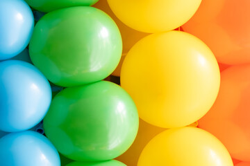 Vibrant balloons arranged in colorful display for celebration event