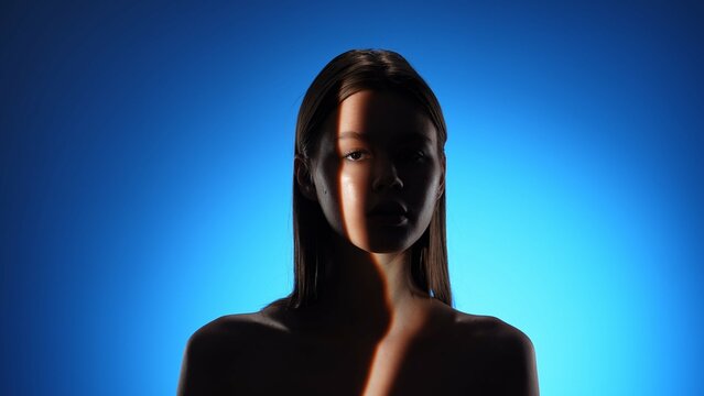 Fototapeta Artistic Portrait of a Woman with Dramatic Light Beam