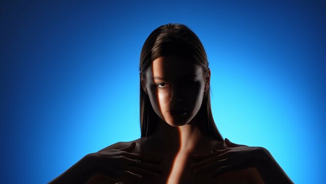 Fototapeta Artistic Portrait of a Woman with Dramatic Light Beam