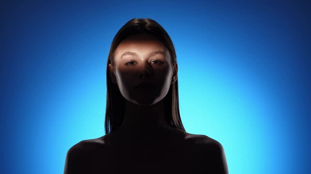 Captivating Portrait with Dramatic Shadow Play and Light Beam