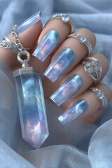 Stunning crystal-inspired nail art captures the essence of shimmering elegance with intricate metallic accessories
