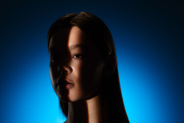Captivating Portrait with Dramatic Shadow Play and Light Beam