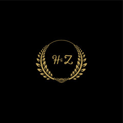 Naklejka premium HZ beautiful, feminine and elegant wedding monogram initial logo with circle floral gold