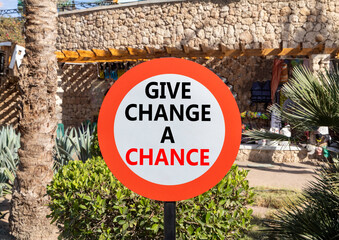 Give change a chance symbol. Concept words phrase Give change a chance on beautiful road sign....