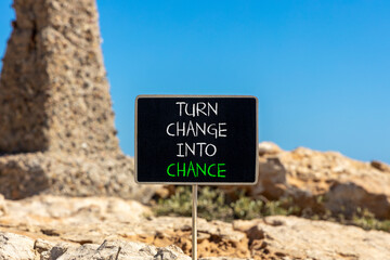 Turn change into chance symbol. Concept words phrase Turn change into chance on beautiful black...