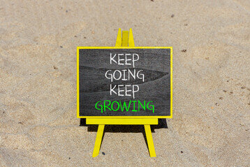 Keep going and growing symbol. Concept words phrase Keep going keep growing on beautiful black...