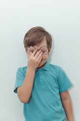 Little Boy in Blue Polo T-shirt on White Background, Child Student in Round Glasses