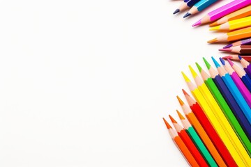 Fototapeta premium Colorful pencils arranged on white background creative art supplies