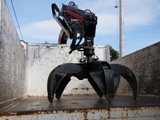 Powerful multi-jaw grapple for industrial material handling on loader or crane. Heavy equipment for...