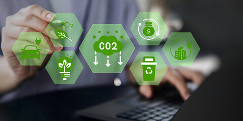 A business person using laptop with ESG environment social governance investment business concept, co2 on visual screen.